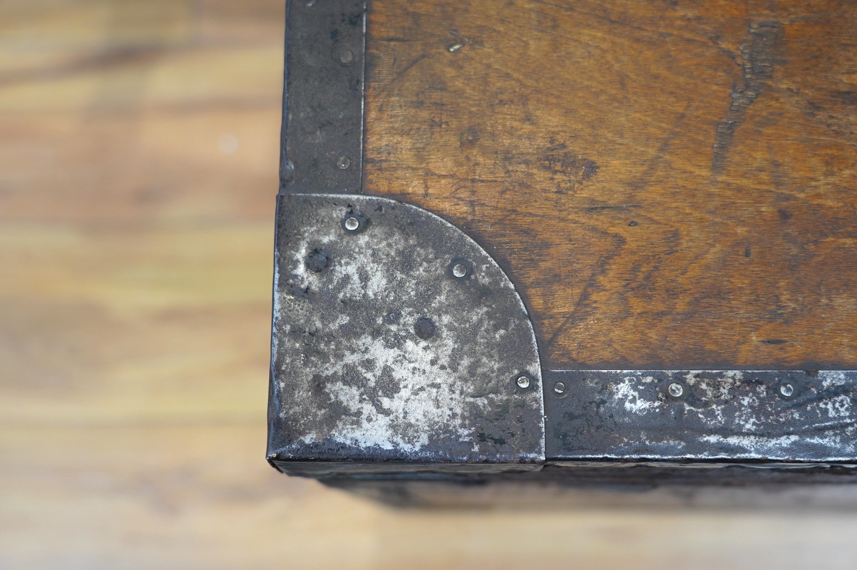 A pine military trunk with steel banding to all edges and corners, and original tin lining, owner’s name painted to the lid; ‘Major W.H. Postle R.A.O.C.’, 91.5cm wide, 54cm deep, 53cm high. Condition - fair to good